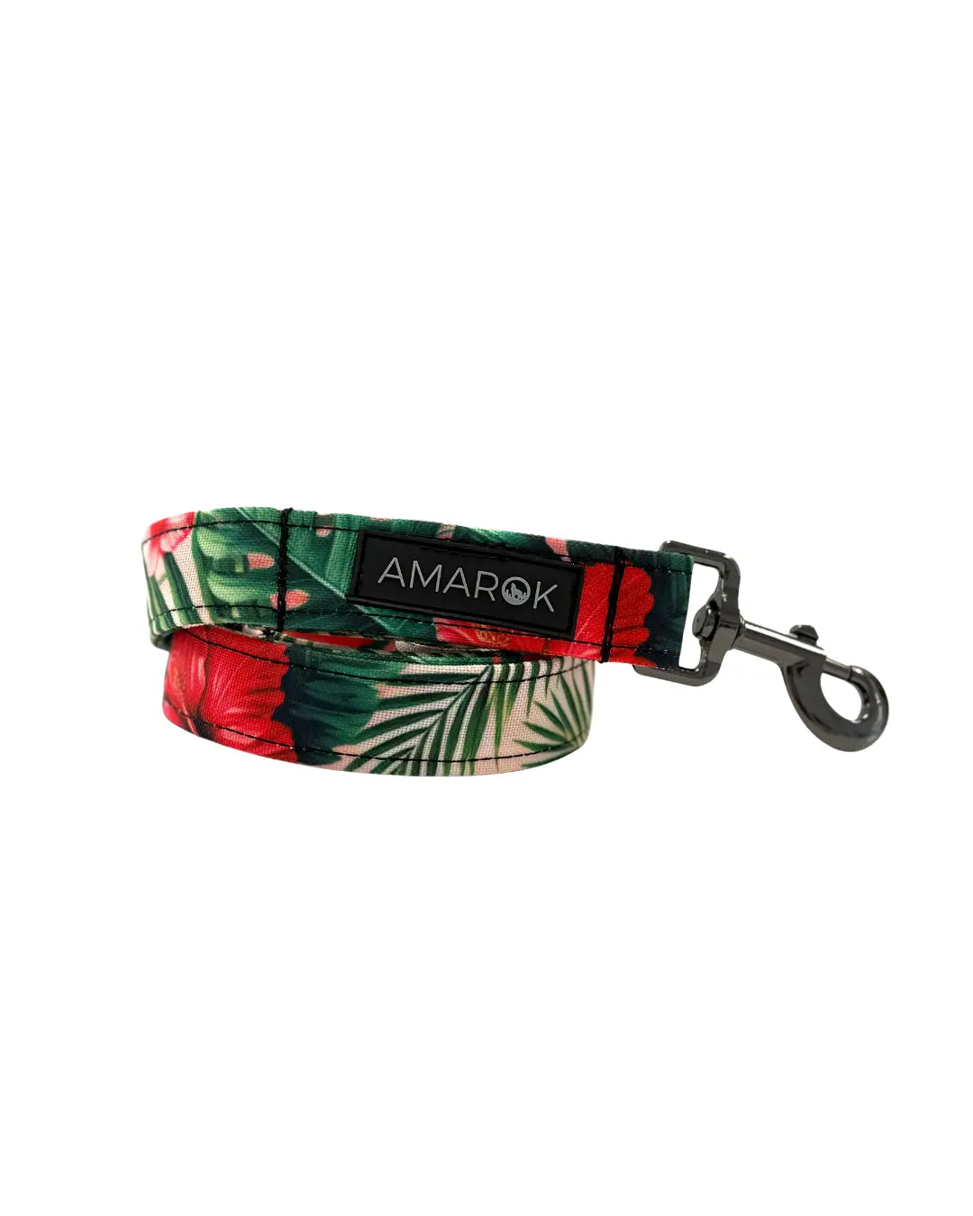 Laisse Aloalo enroulée mettant en valeur le motif tropical coloré. Rolled-up Aloalo dog leash showing off the colorful tropical pattern